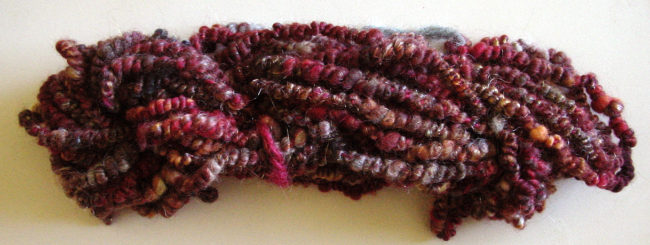 Supercoiled corespun yarn
