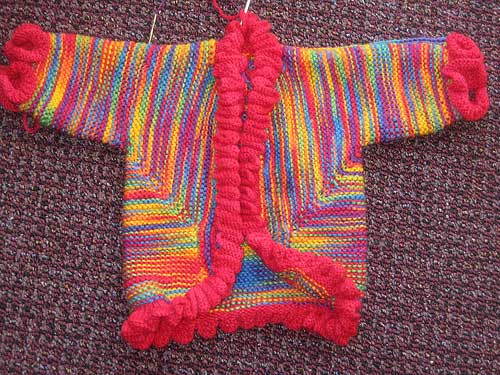 Baby surprise jacket with ruffled edging