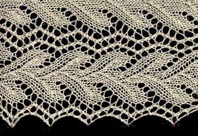 Knitted lace edging with coral or vine patterning