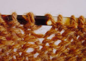 Working a yarn over before a purl stitch. Diagram 2