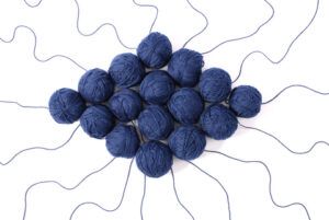 Messy blue balls of yarn