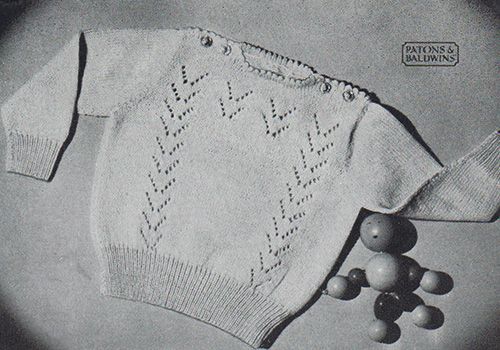 Free knitting pattern for a baby jumper/sweater with flying geese lace patterning