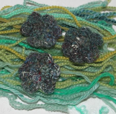 Crochet flowers on yarn