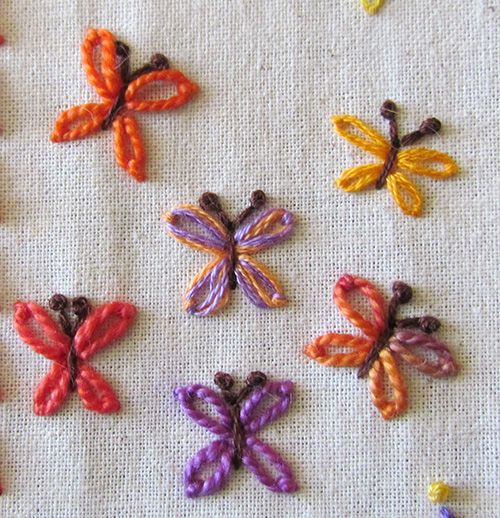 Butterflies worked in detached chain stitch