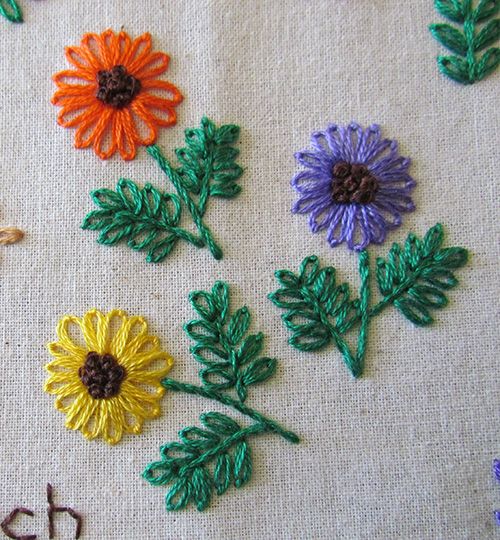 Embroidered flowers worked in detached chain stitch, stem stitch and french knots