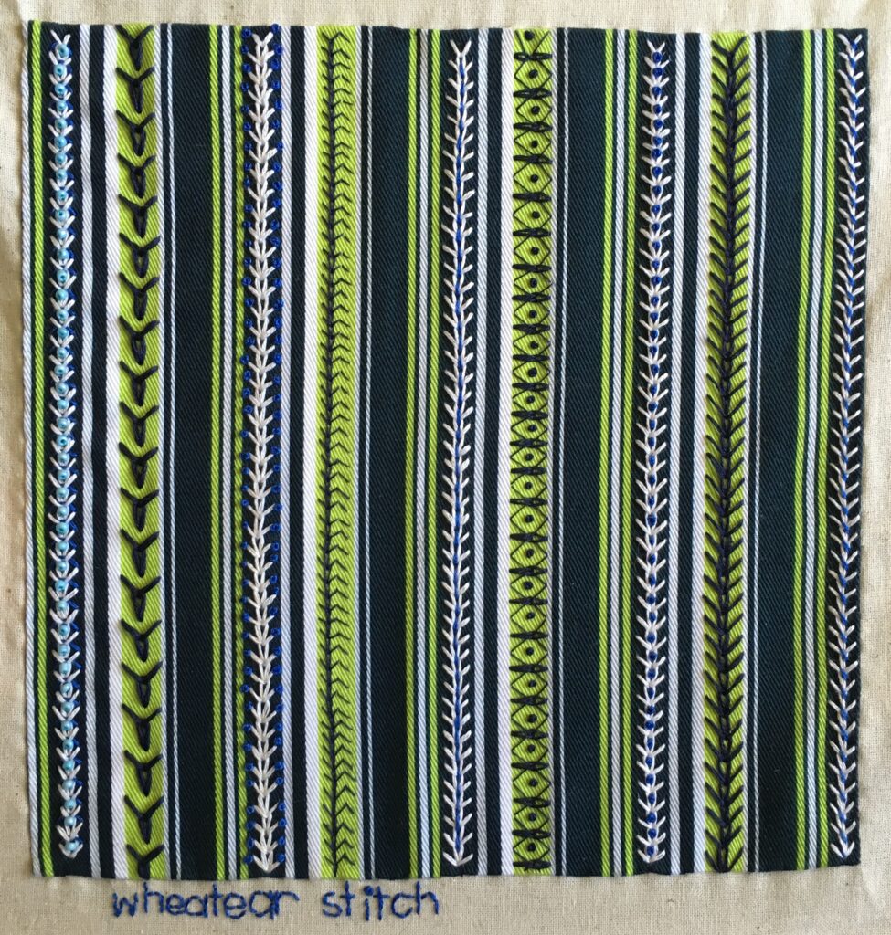 Wheatear stitch sampler on striped twill cotton