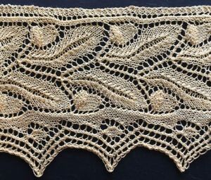 Victorian style knitted lace edging with two rows of acorns ad oak leaves