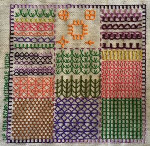 Embroidered sampler with up and down buttonhole stitch fillings.