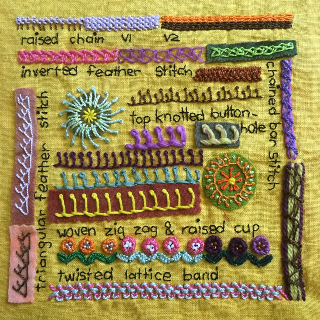 Embroidered sampler with a range of stitches on yellow fabric.