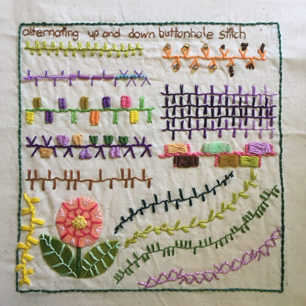 Embroidery sampler on calico featuring alternating up and down buttonhole stitch.