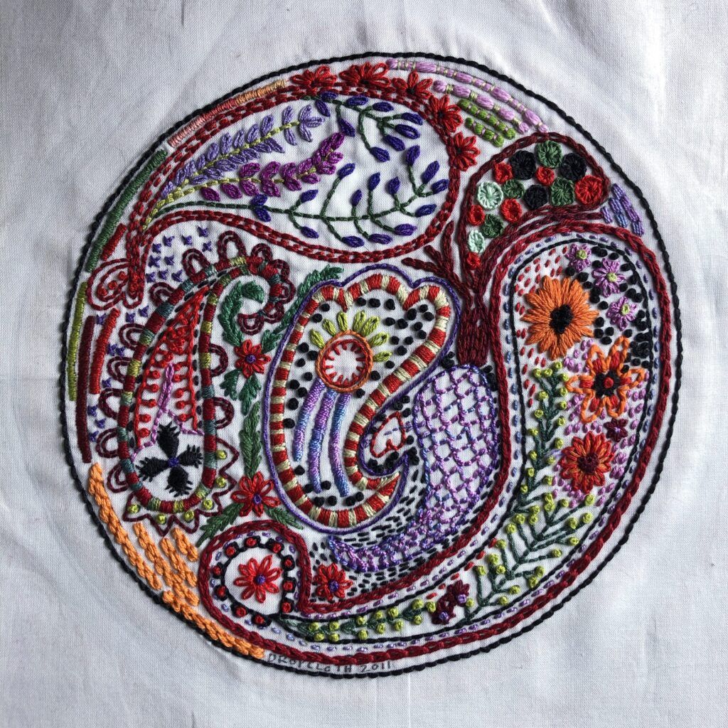 Paisley sampler from Dropcloth, worked in a variety of threads.