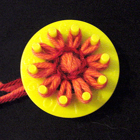 Winding a flower on a loom