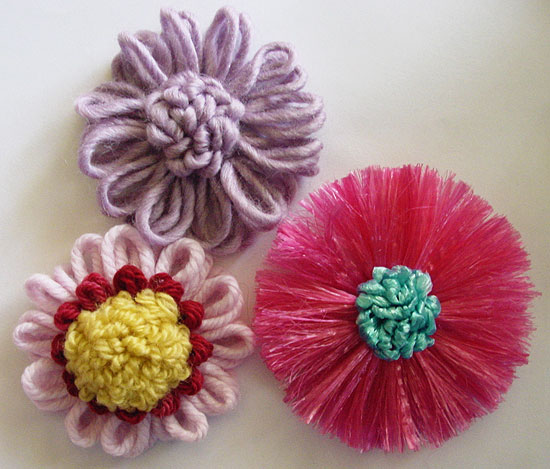Yarn and raffia straw flowers with loop stitch centres