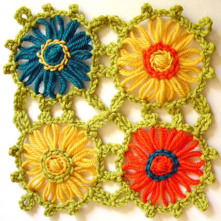 Loomed flowers with a crochet edging then sewn together