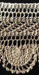 Knitted lace edging with scalloped border