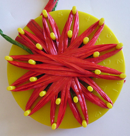 Winding a strawberry on a flower loom