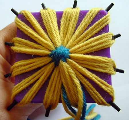 A finished flower still on the daisy winder