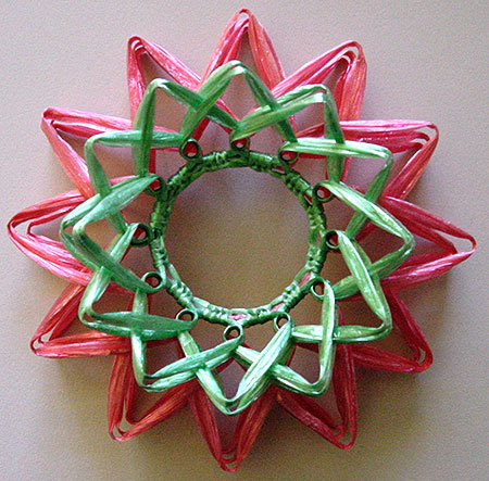 A finished swiss straw flower made with the layered wrap technique