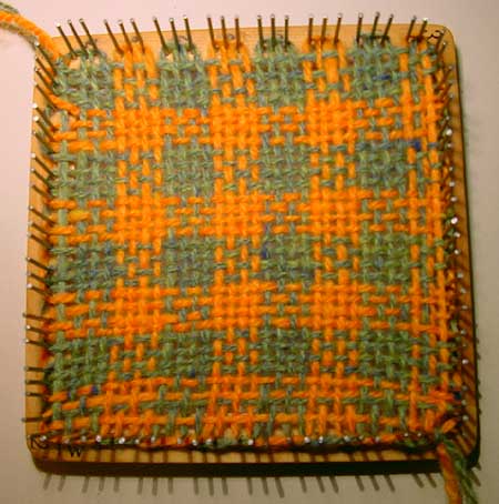 The finished weaving on the weavette loom