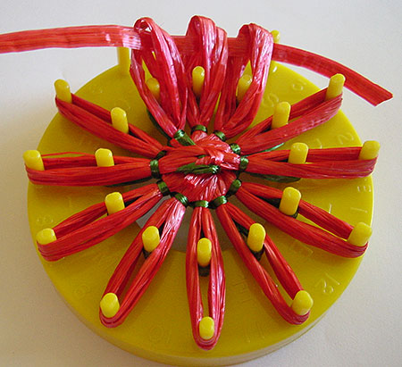 Gathering a strawberry on a flower loom