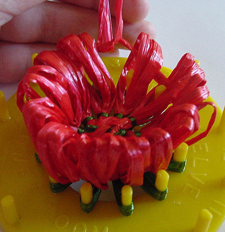 Gathering a strawberry on a flower loom