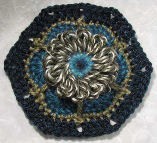 The crocheted african flower motif with a loomed flower center