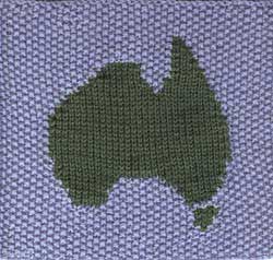 Hand knit afghan stitch with intarsia Australian map and seed stitch background.