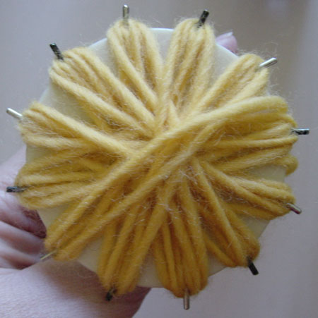 Making a beaded flower on a flower loom