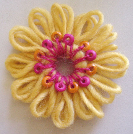 Making a beaded flower on a flower loom