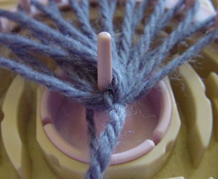 Winding a bud on a flower loom