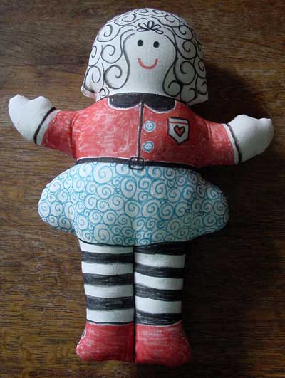 Calico doll coloured with fabric pens