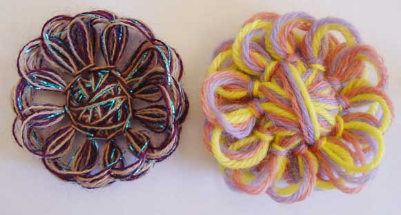 Two crazy daisies made of fine and medium wieght yarns