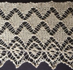 Wide knitted lace with diamond design