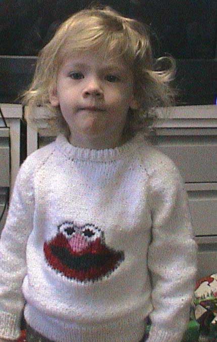 White sweater with Elmo on the front