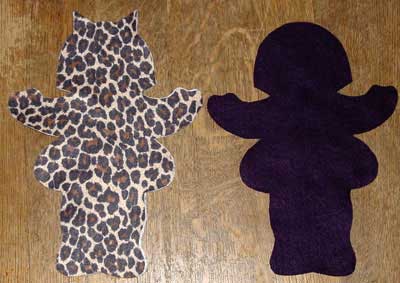 Leapord spot doll cut with cat ears and purple doll with bonnet