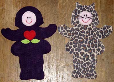 Felt doll pieces with faces and decoration added