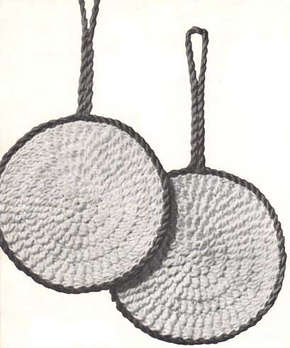 Two potholders in the shape of frying pans