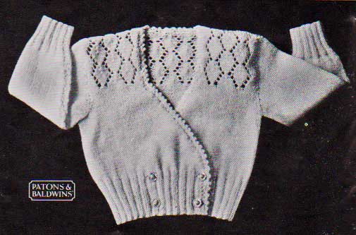 Knitted baby cardigan sweater with diamond lace patterning