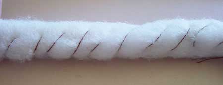 Tube of batting sewn permanently into shape