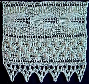 Wdie knitted lace with embossed leaf and bobble pattern