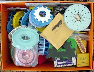 A box full of different types of flower looms.