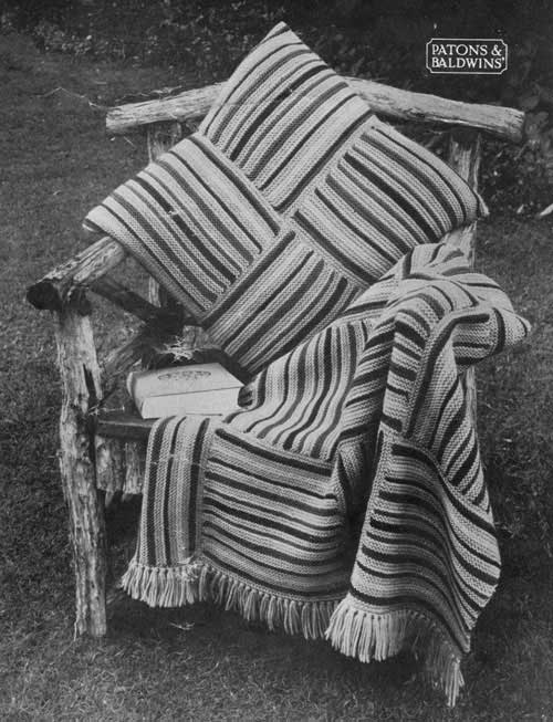 Knittede blanket and cushion made from striped squares