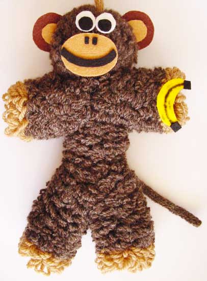 Toy monkey made on a flower loom