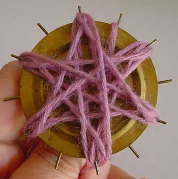 Winding a flower on a loom