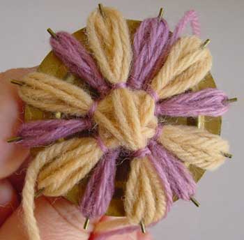 Winding a flower on a loom