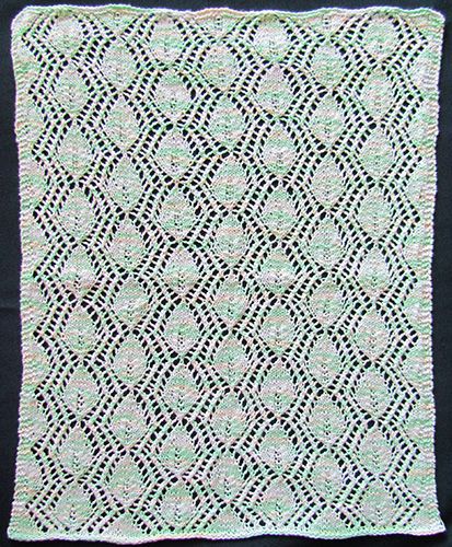 Rectangular lace leaf doily knit from a Victorian era knitting pattern.