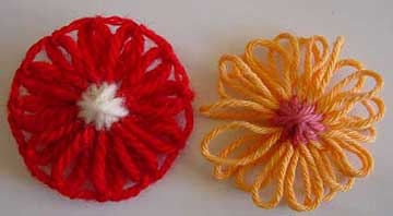 Loomed yarn flowers with oversewn centres