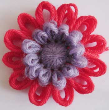 Loomed flower with a puffy centre.