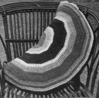 wedge shaped crochet cushion with rainbow stripes