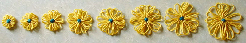 Eight of the ten sizes of flower that can be made on the Cottrell adjustable flower loom